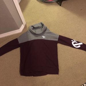 Pink turtle neck sweatshirt.